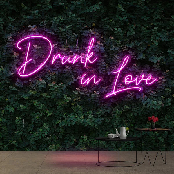 greenery wall with neon sign wedding